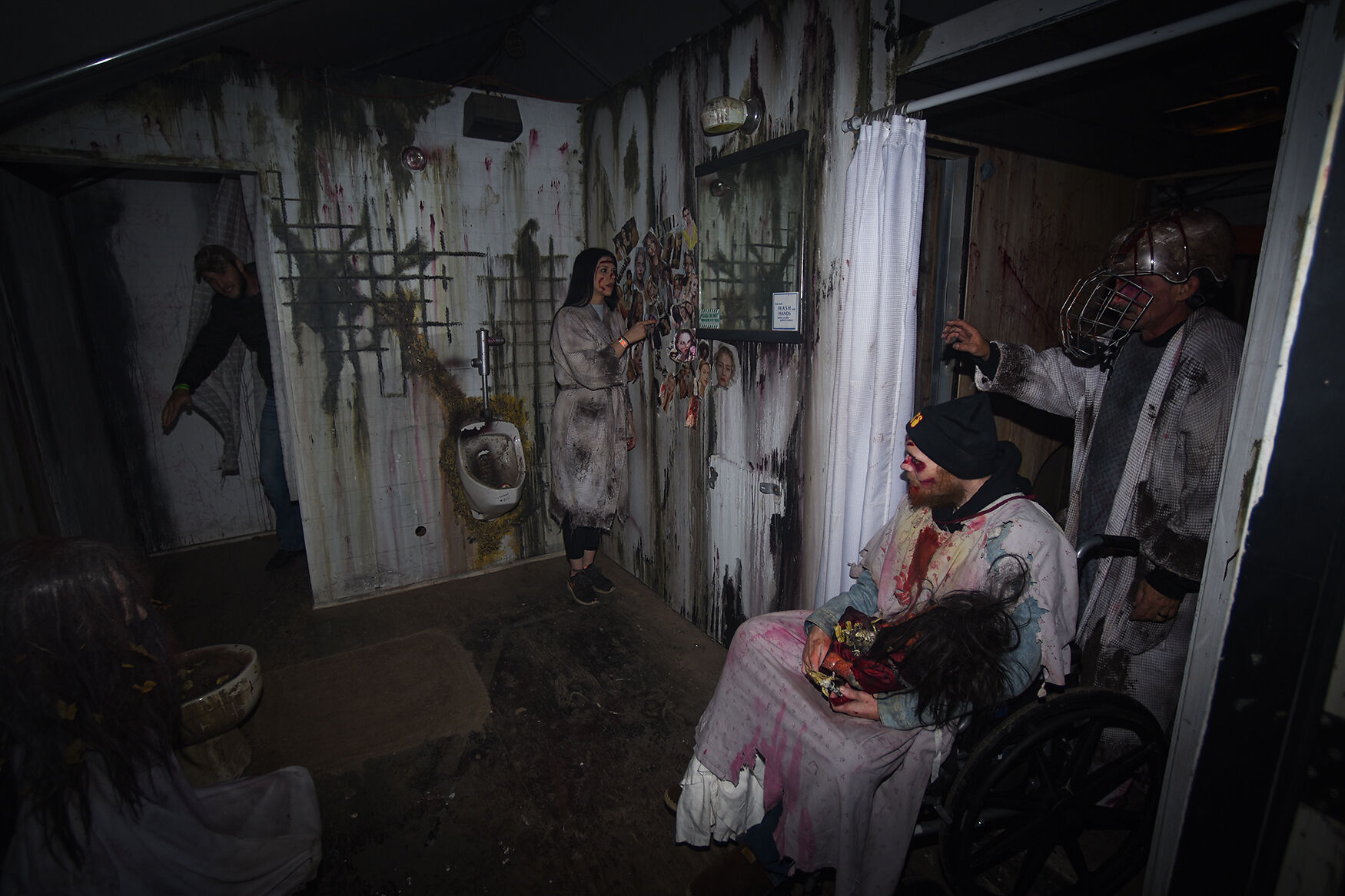 Jessica Fisher, left, and Allen Fisher perform inside The FearFest Haunted house